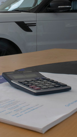 Calculator on desk in dealership